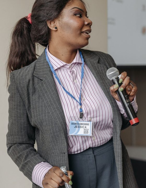 Conference speaker holding a microphone